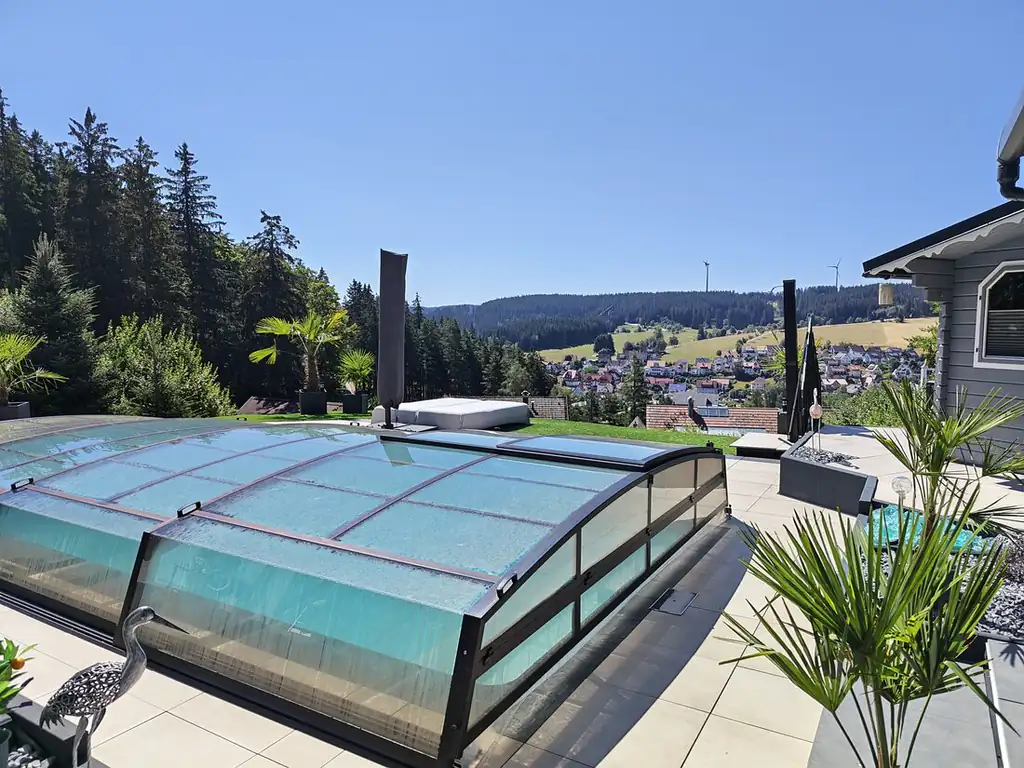 Low telescopic pool enclosure with a view of the Black Forest panorama