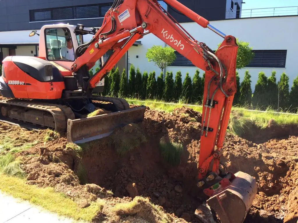 Excavator digging out a new swimming pool