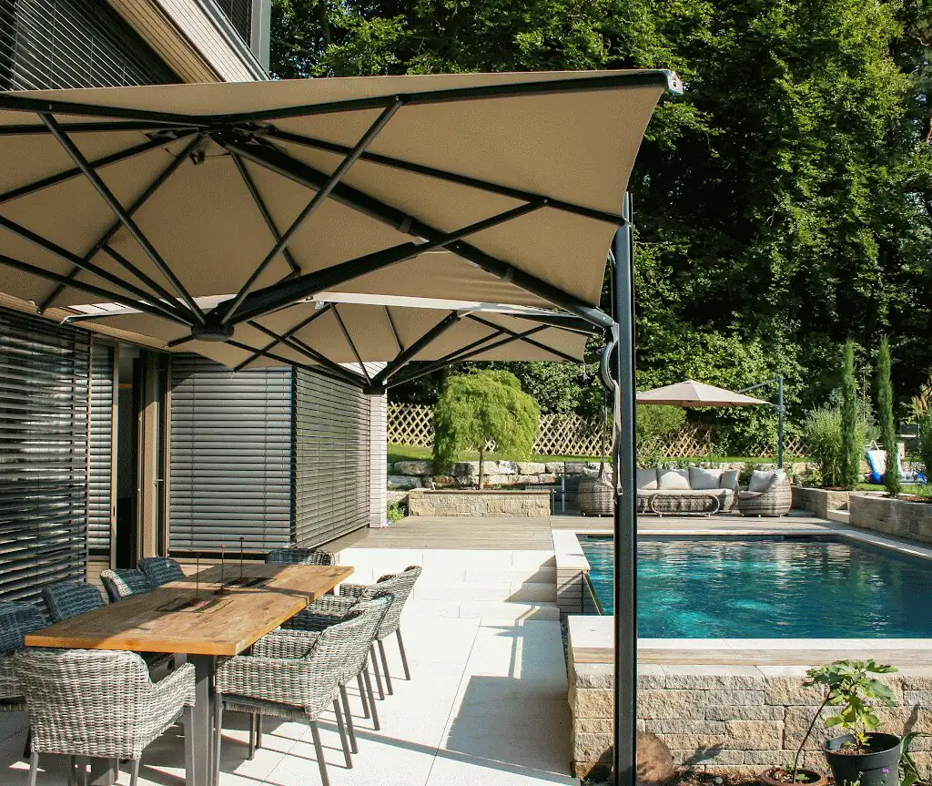 Dining area on the terrace, pool with glass wall on the right in Villingen-Schwenningen