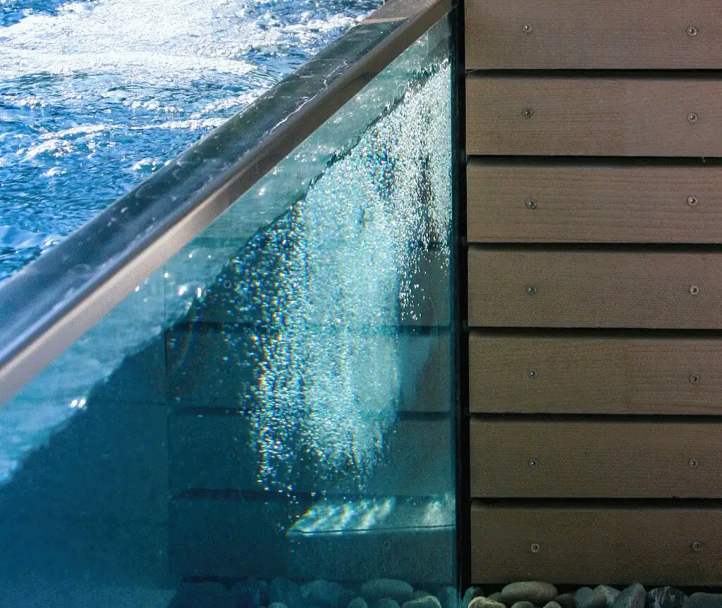 Detail of the glass wall with water and stainless steel edge in Villingen-Schwenningen