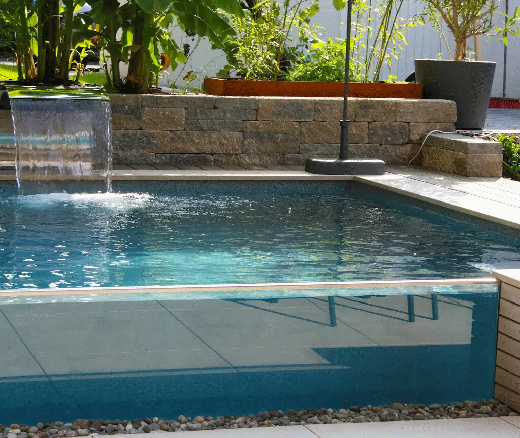 Pool with glass wall and waterfall, steps in front in Villingen-Schwenningen