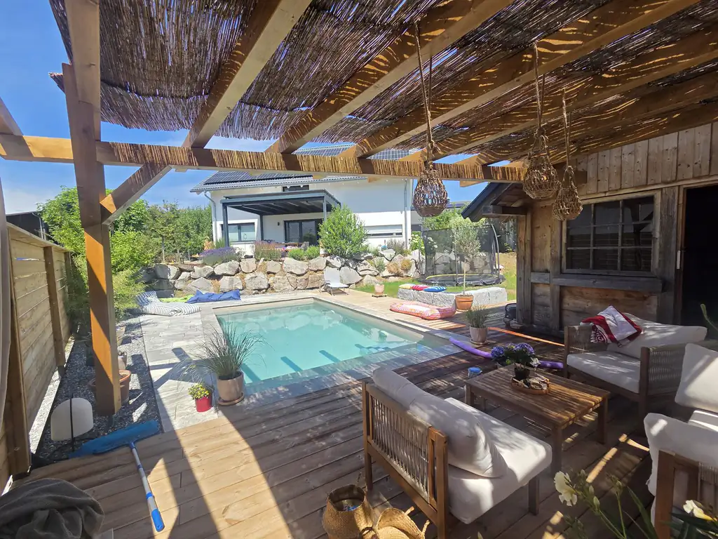 Pergola with reed-mat roof and lounge by the pool in Villingen-Schwenningen