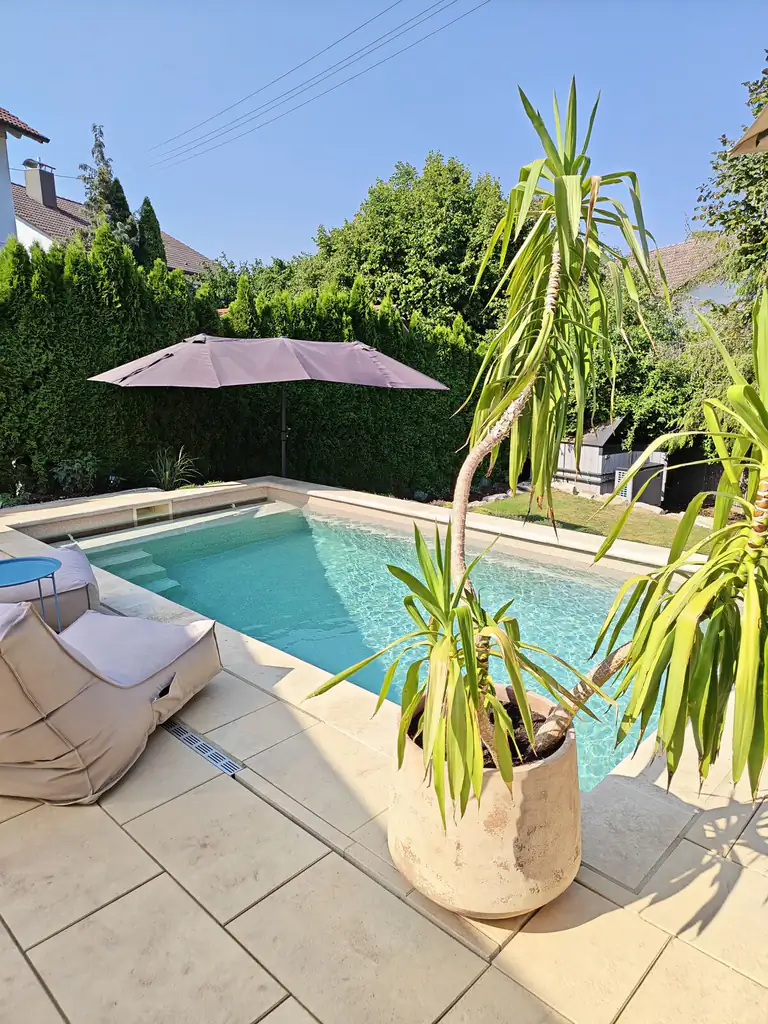 View across the pool towards the shade sail in Villingen-Schwenningen
