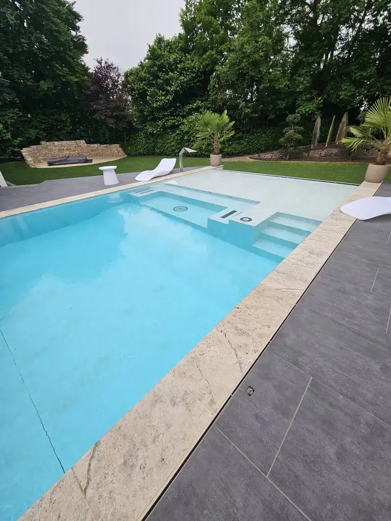Pool edge with travertine coping and the stepped area in Villingen-Schwenningen