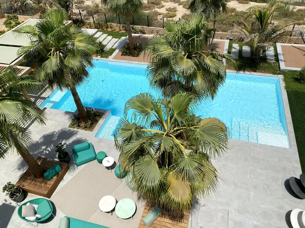 View across the resort pool towards the palms in Dubai